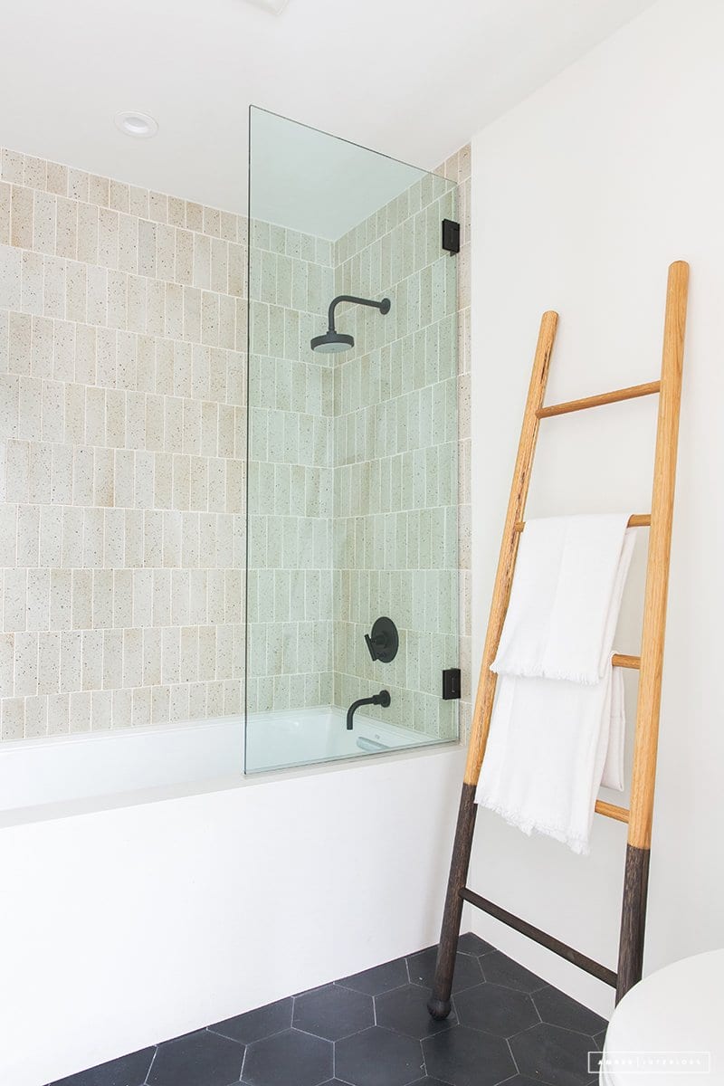 a modern, bright shower designed by amber interiors design and shot by tessa neustadt photography.