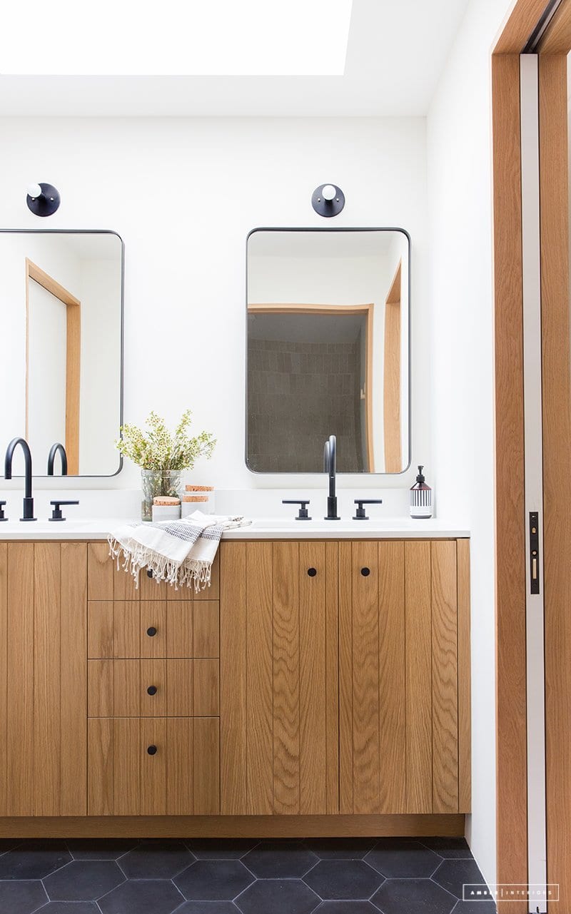 a modern, bright bathroom designed by amber interiors design and shot by tessa neustadt photography.