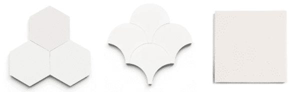 a selection of clé tile solid white cement tiles in three shapes: hexagon, scallop, and square.