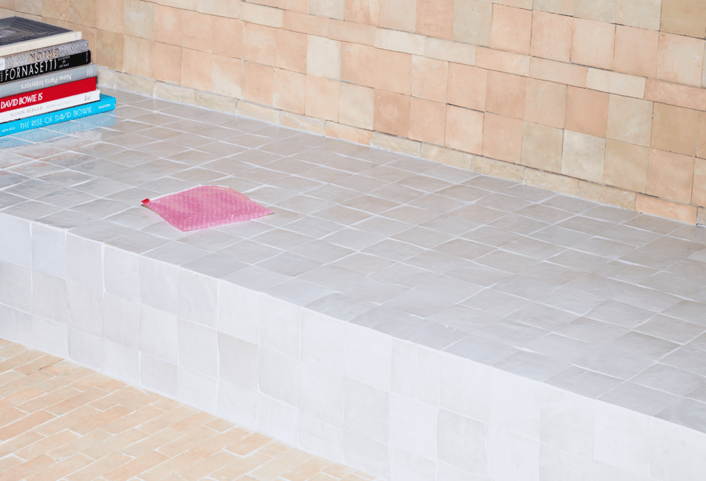 a tiled step featuring cle tile zellige squares and bejmat rectangles in weathered white and unglazed natural