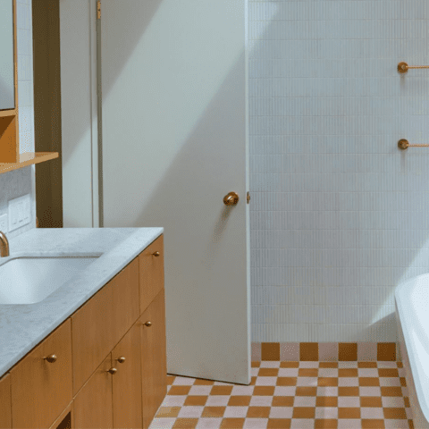 a retro style bathroom complete with checkerboard floors and cle tile modern farmhouse brick matte white tile on the shower wall.
