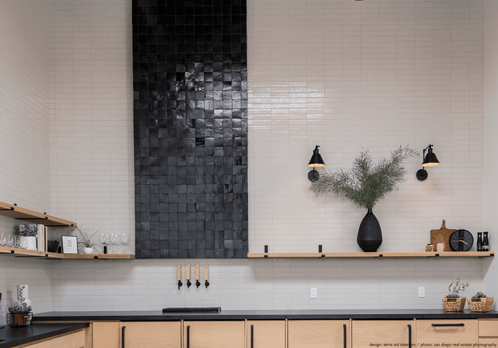 a tiled kitchen backsplash and wall with no trim