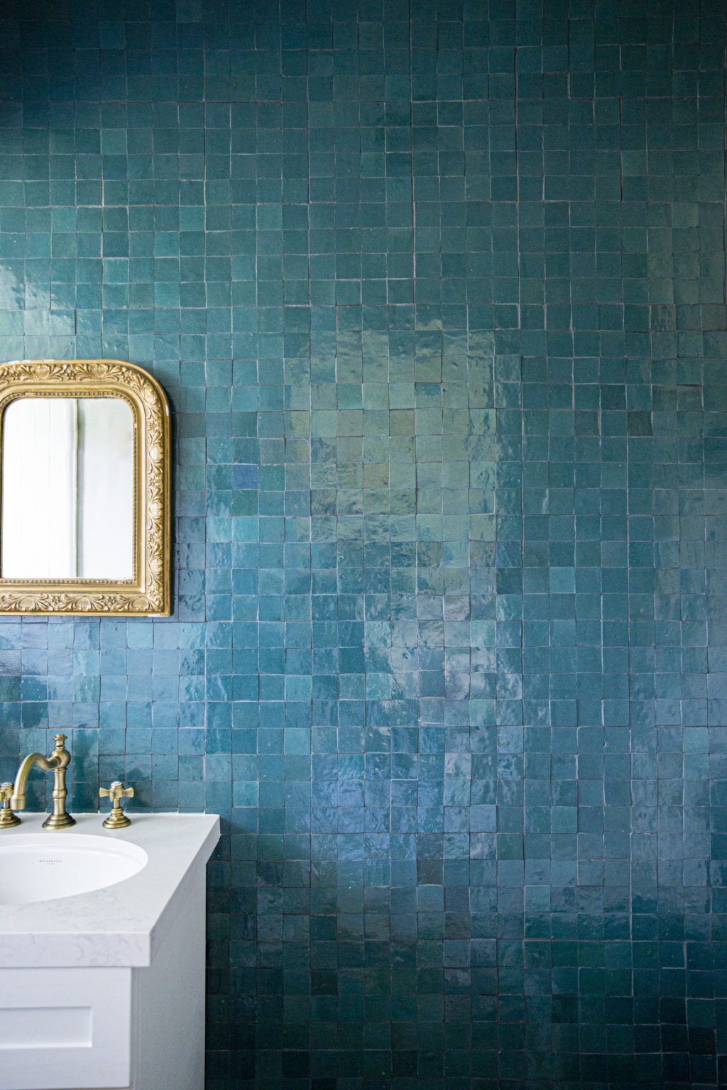 bathroom backsplash with clé tile zellige glazed terracotta fired opal 2x2 square tiles on the backsplash