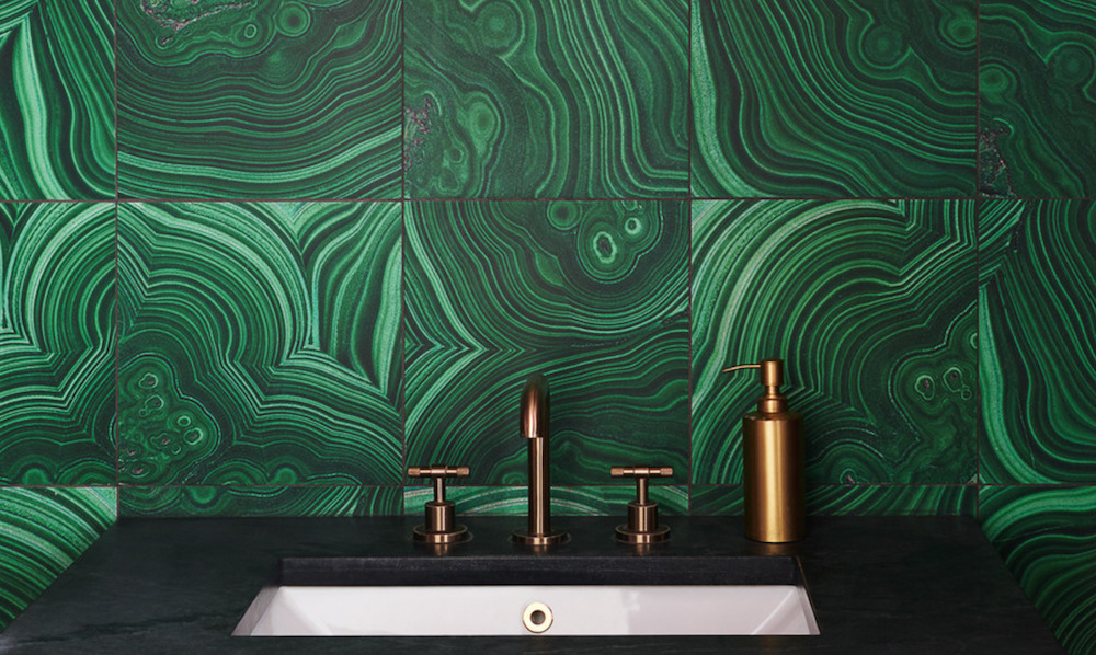 a bathroom backsplash featuring clé tile malachite tiles.