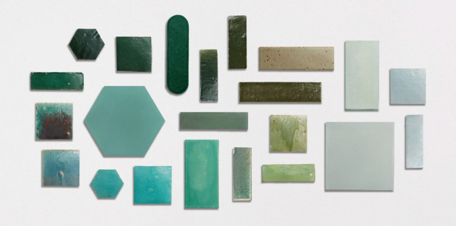 a collection of clé tile zellige and cement tiles in a range of green hues.